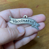 Vaccinated pewter badge